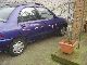 1995 Mazda  Canvas Top 121 GLX 16V 4 door. Ragtop. Small Car Used vehicle photo 2